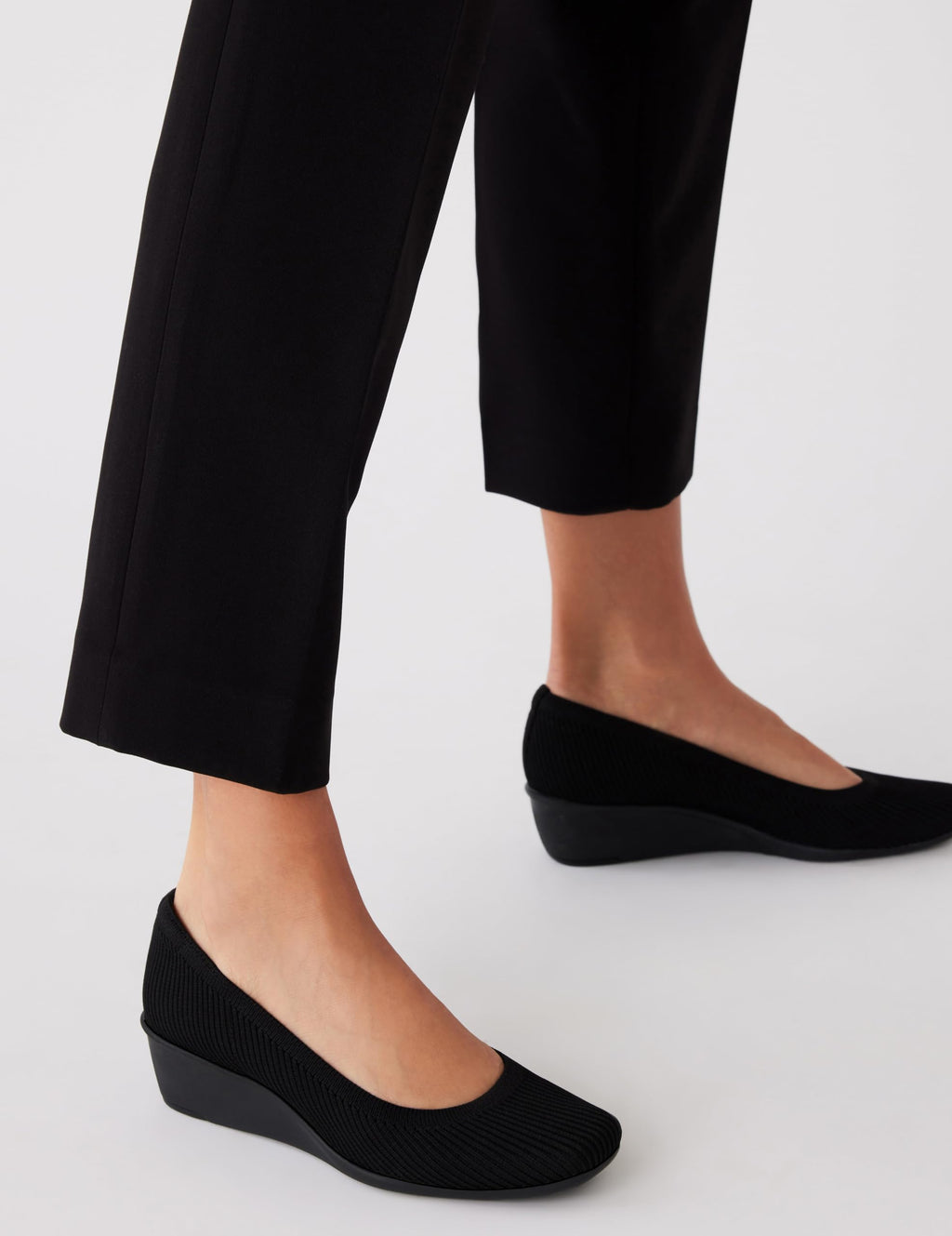 Anne Klein Women's Wisher Closed Toe Comfortable Slip-On Business Casual Pump Wedge, Black Knit, 9
