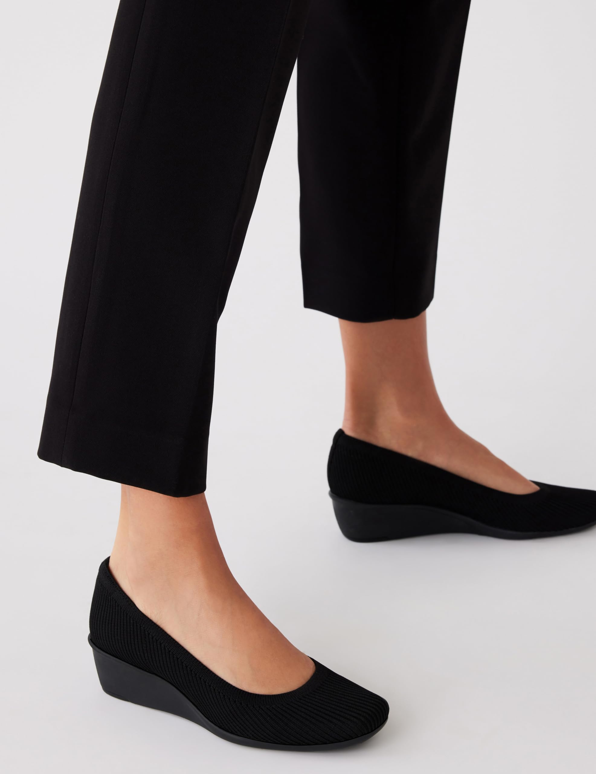 Anne Klein Women's Wisher Closed Toe Comfortable Slip-On Business Casual Pump Wedge, Black Knit, 9