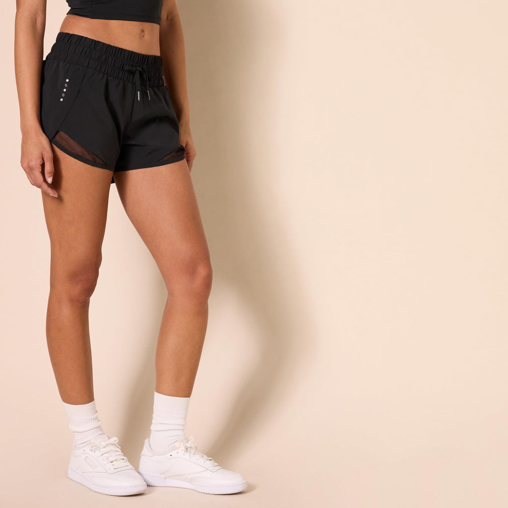 Amazon Essentials Women's Regular-Fit Athletic Ruched Waistband Woven Running Shorts with Zip Pocket, Black, Large