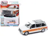1985 Dodge Caravan Van White with Woodgrain Side Panels ""Mighty Minivans"" Series 1/64 Diecast Model Car by Auto World