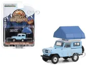1969 Nissan Patrol (60) Light Blue with White Top and Campotel Cartop Sleeper Tent ""The Great Outdoors"" Series 3 1/64 Diecast Model Car by Greenlight