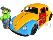 1959 Volkswagen Beetle Taxi Yellow and Blue ""Oscars Taxi Service"" and Oscar the Grouch Diecast Figure ""Sesame Street"" ""Hollywood Rides"" Series 1/24 D