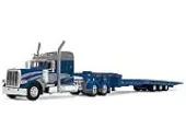 Peterbilt 389 with 48"" Mid-Roof Sleeper and Talbert 5553T Traveling Axle Trailer Rich Blue and Silver 1/64 Diecast Model by DCP/First Gear