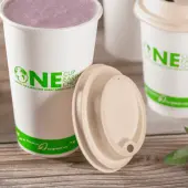 Karat Earth 90mm PFAS Free Bagasse Sipper Dome Lids for 10-24oz Hot Cups, Natural - 500 pcs