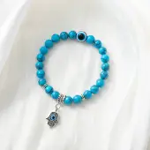 Synthetic Turquoise Stretch Bracelet with Evil Eye Charms